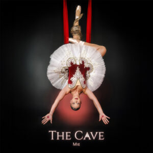 Album cover for “The Cave” by Mie, featuring dark, cinematic imagery symbolizing descent, introspection, and transformation.